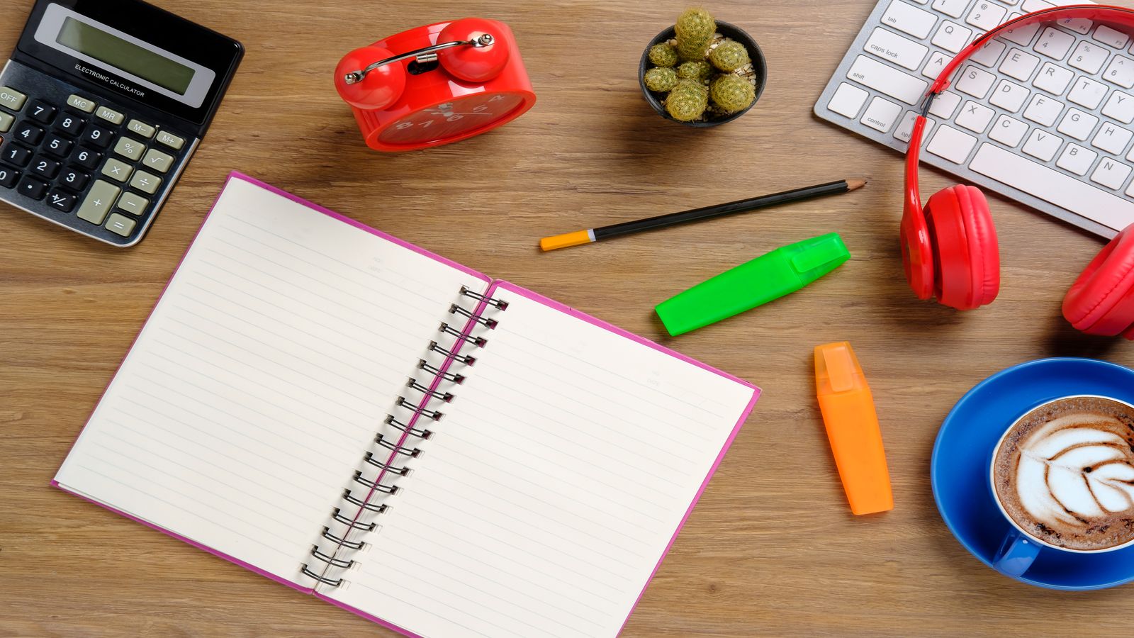 A clean calculator interface displaying savings measured in satoshis alongside a small Bitcoin symbol, set on a simple wooden desk