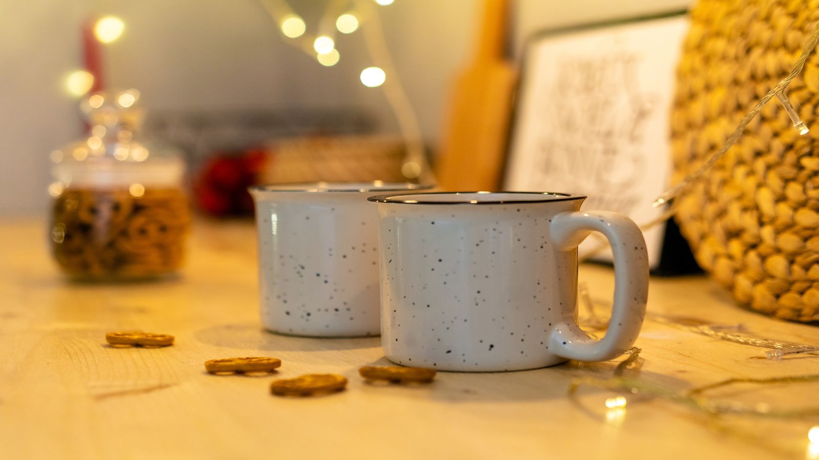 A kitchen table with two coffee cups and an open notebook, suggesting an honest morning conversation between partners