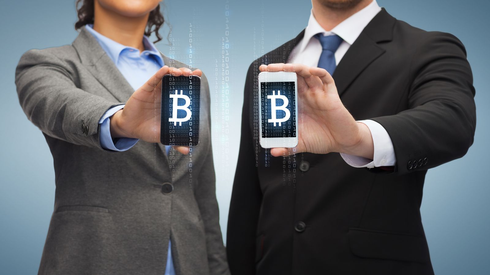 Two hands clasped together in natural light, a simple and genuine gesture of partnership