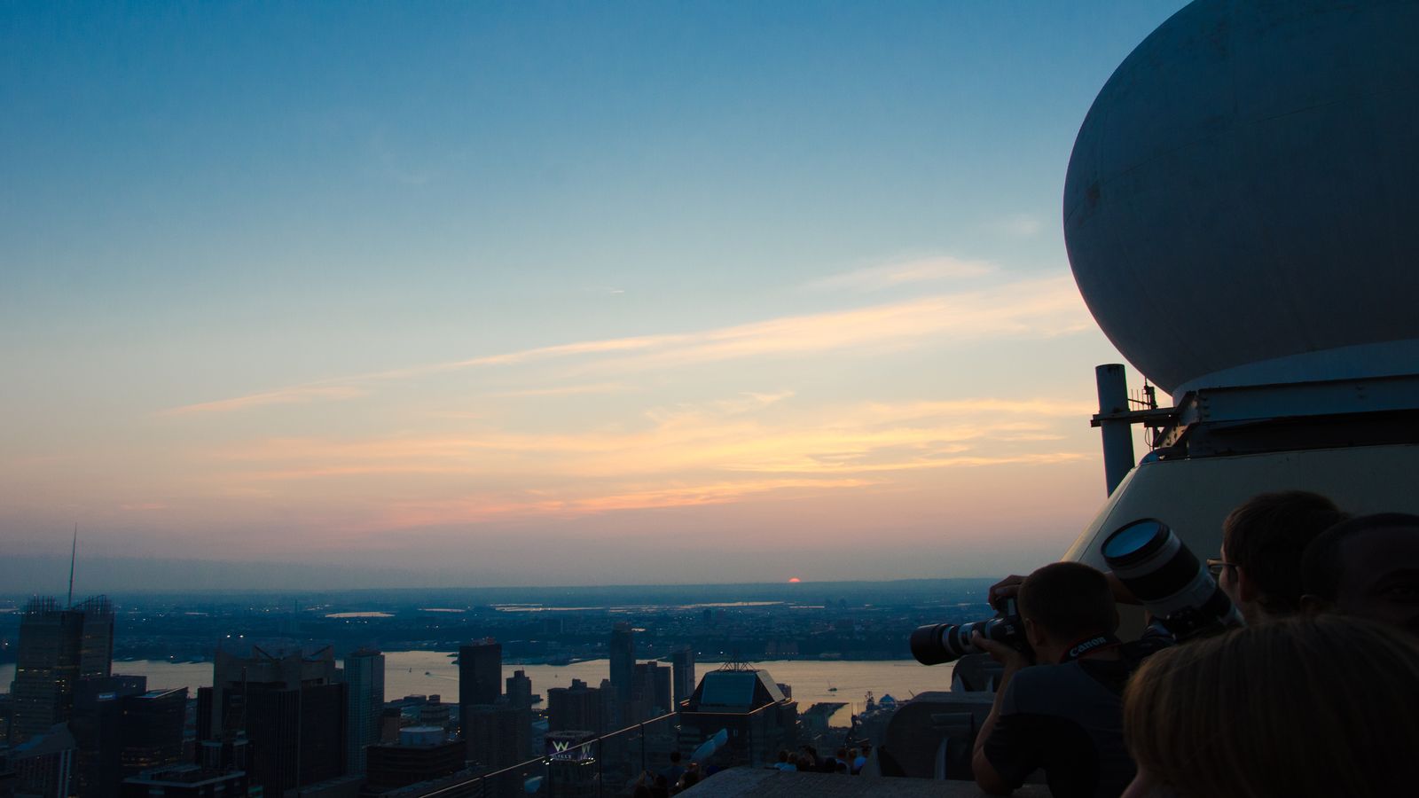 A bustling street market with colorful stalls and handwritten price signs, evoking the everyday economic reality of people navigating rapid inflation
