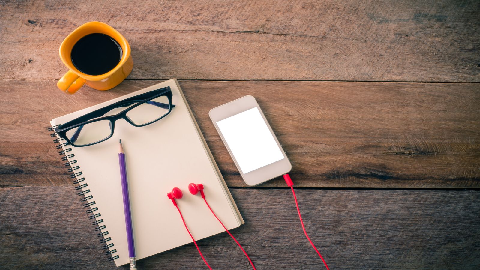 A simple desk with a pen resting on an open envelope beside a closed laptop, representing direct communication