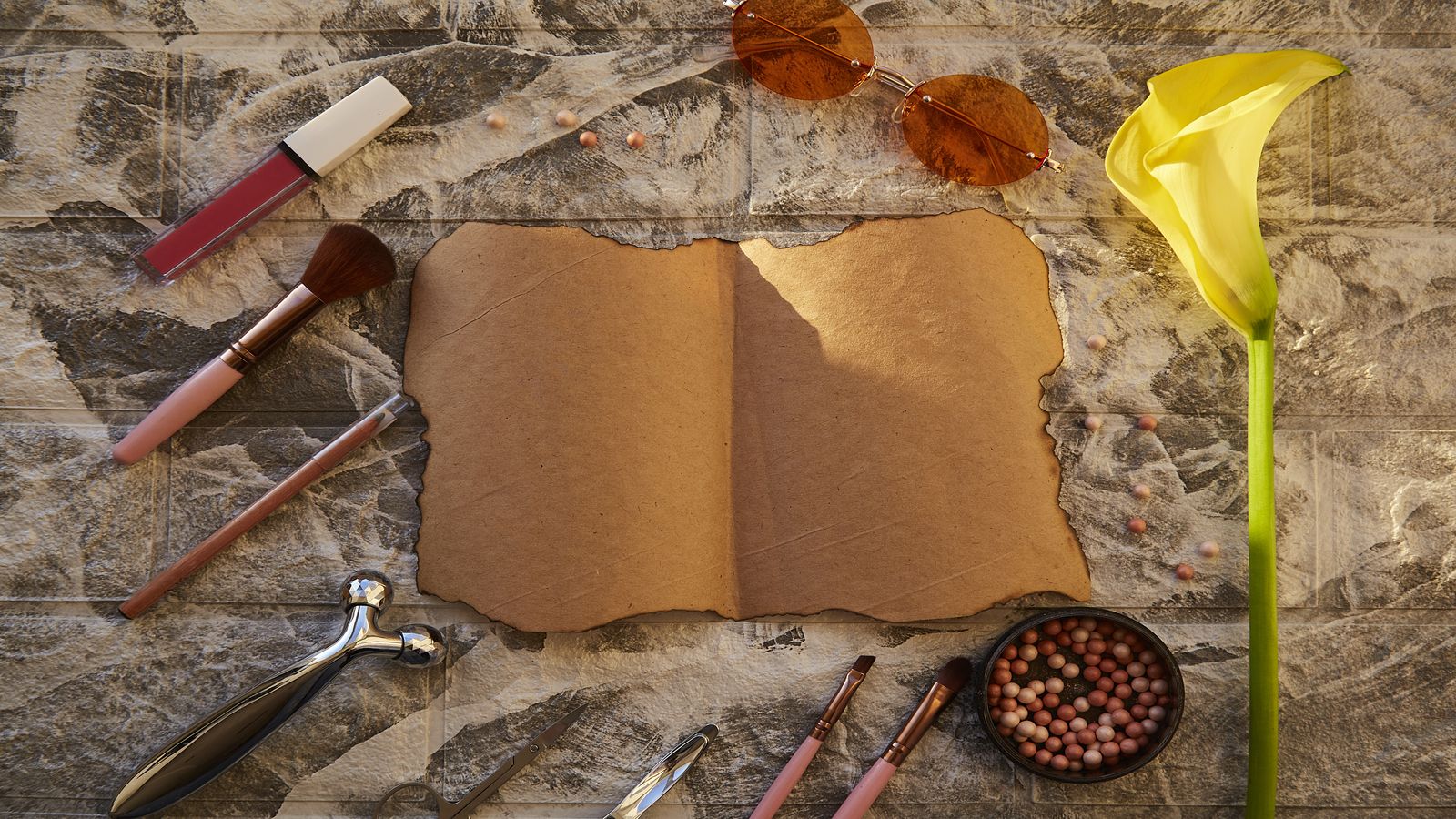 A weathered notebook open on a wooden table beside a pen and a cup of black coffee, representing the deliberate practice of editorial writing