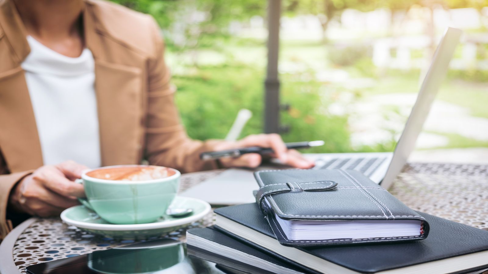 A quiet desk with a hardware wallet, a notebook, and a cup of coffee, representing the calm, deliberate practice of learning Bitcoin